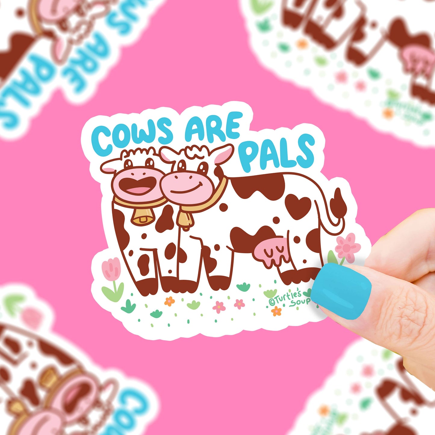 Sticker featuring two smiling cows on a pink background.