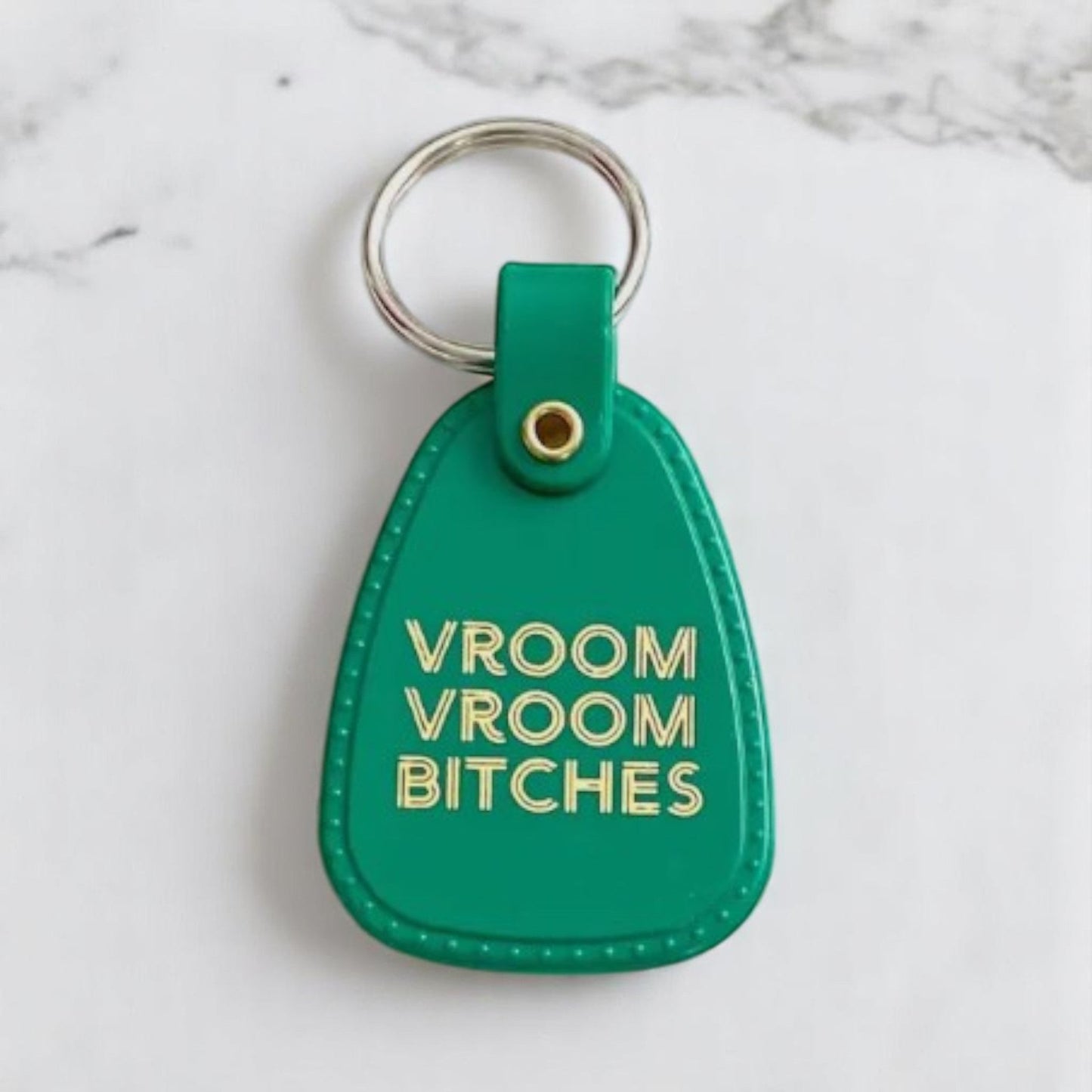 Green leather keychain with gold lettering