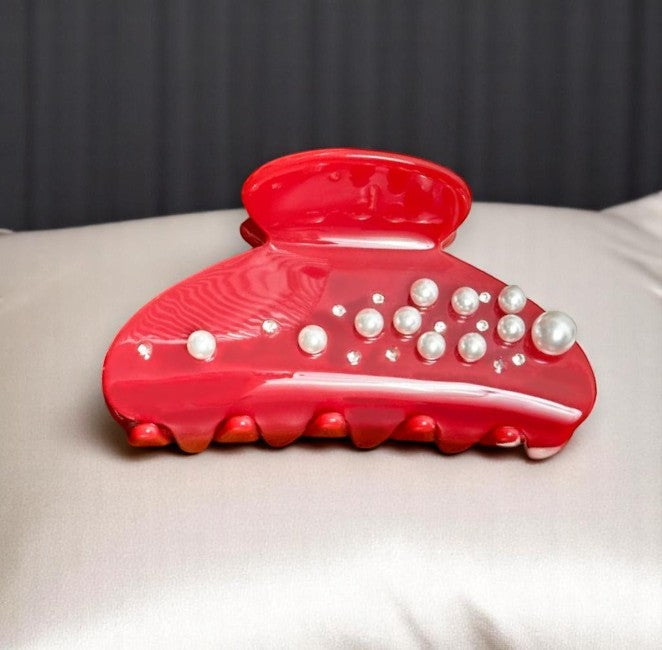 Red hair clip decorated with pearls
