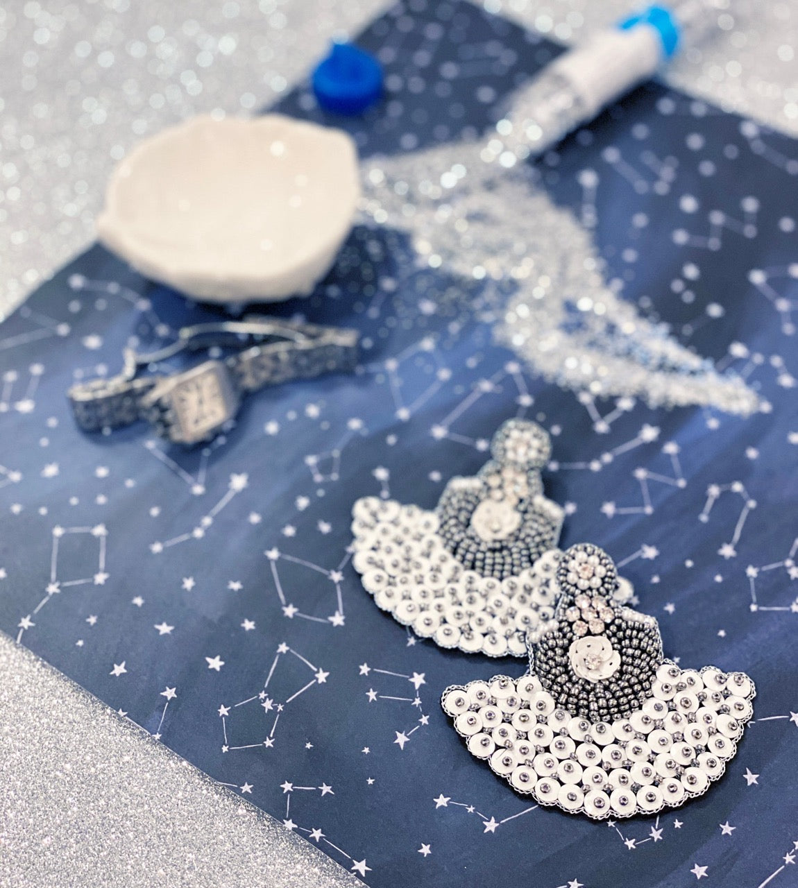 Lightweight hypoallergenic earrings with a beautiful white beaded and silver design, handcrafted for style.