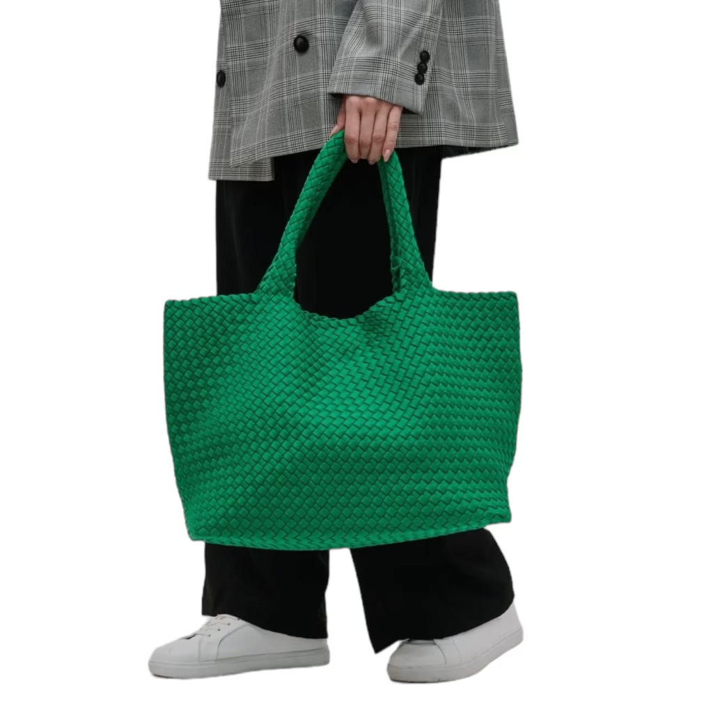 Fashionable green tote bag with a woven design, perfect for summer outings.