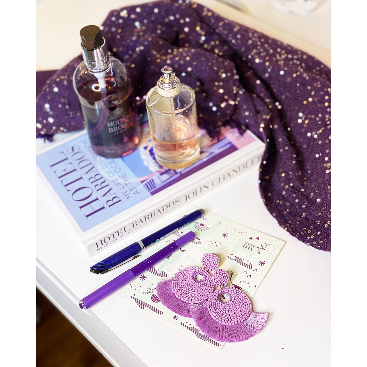 Petite lilac earrings with playful bee and floral stitchwork, perfect for adding a touch of nature.