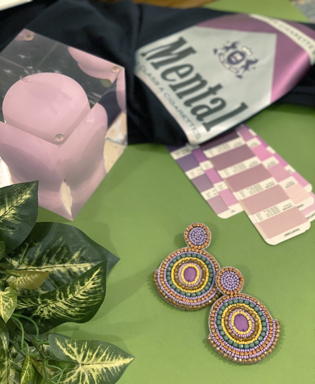 Handmade hypoallergenic violet earrings with Persian rug design and unique detail.