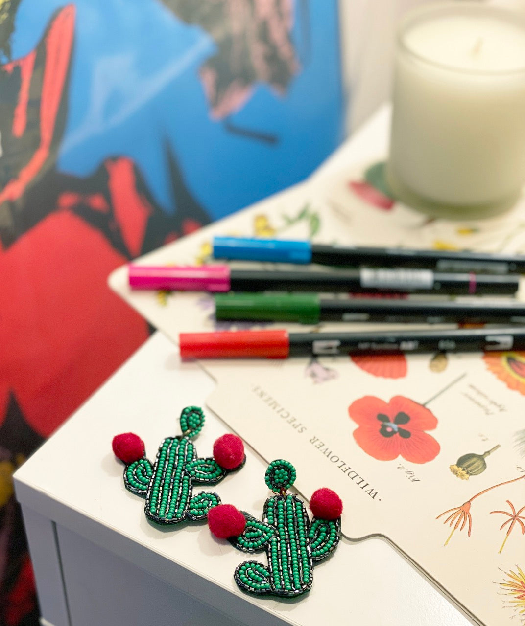 Handmade hypoallergenic cactus earrings with coral tassels and unique detail.