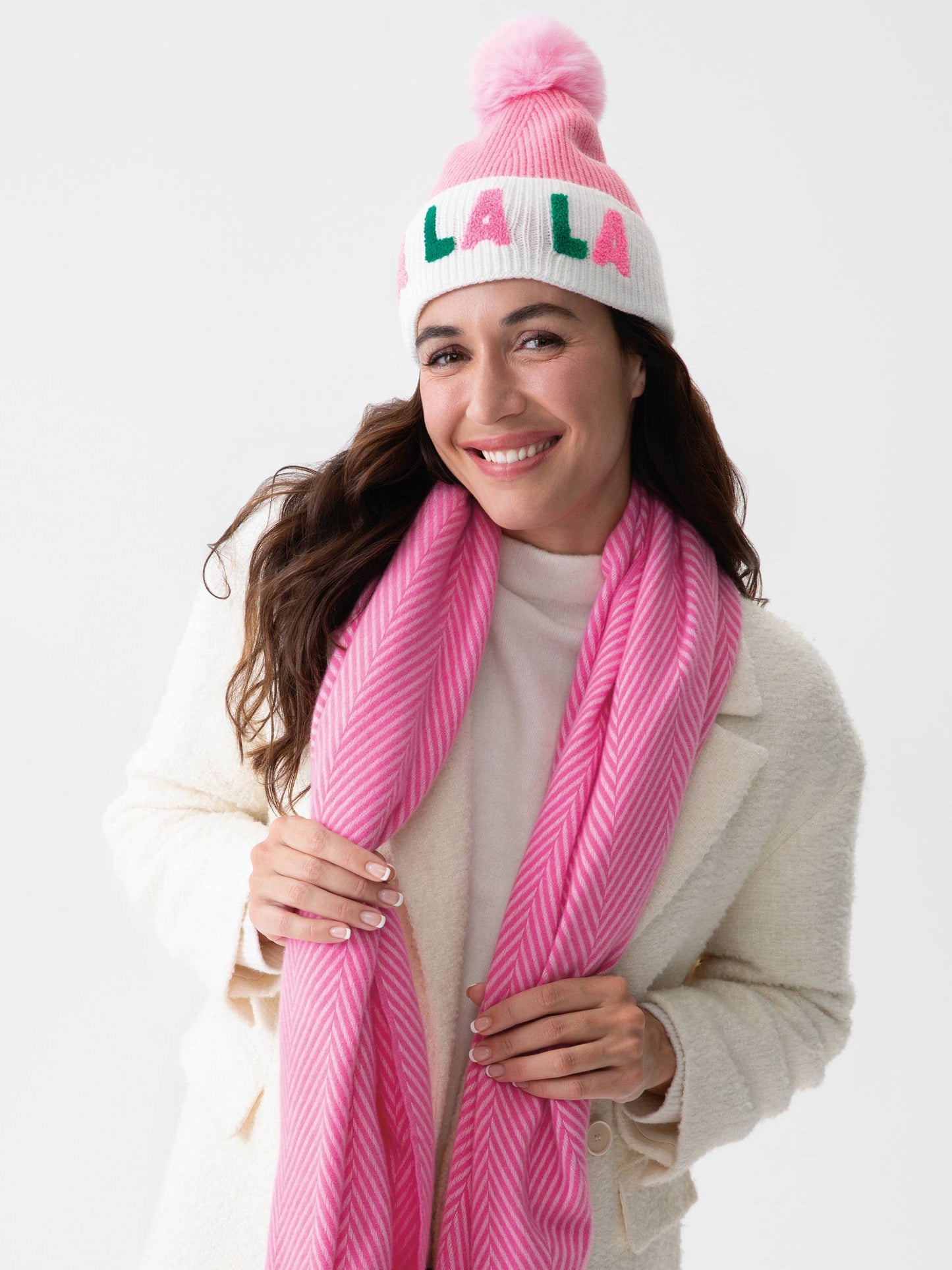 Cozy winter beanie featuring "FA LA LA" text