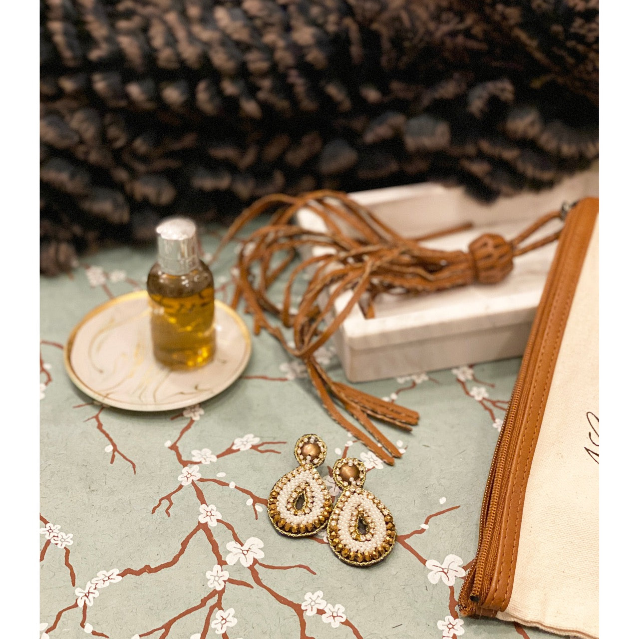 Handmade hypoallergenic ivory earrings with intricate beaded design and unique detail.