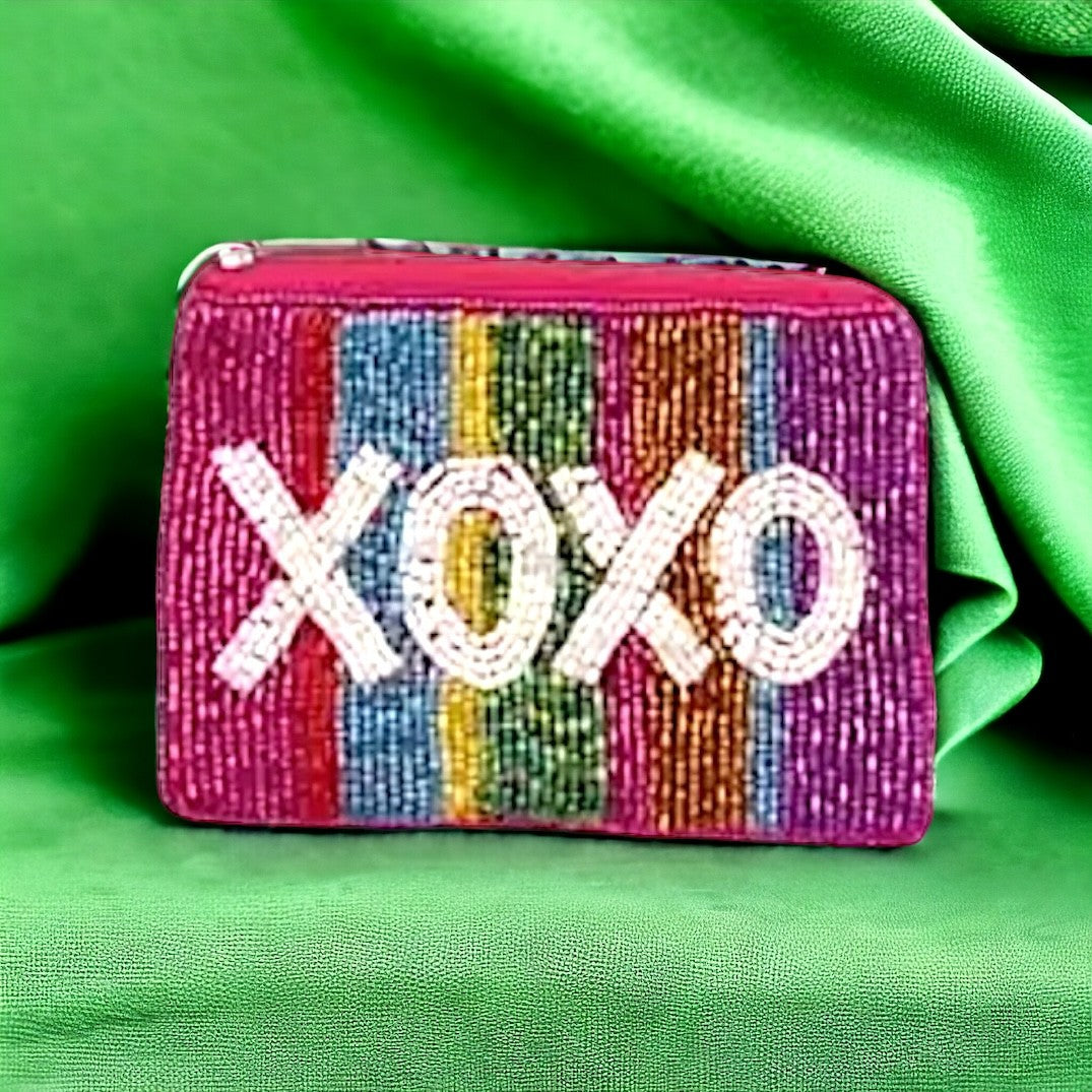 Artistic XOXO beaded pouch with a rainbow pattern, ideal for fashion lovers.
