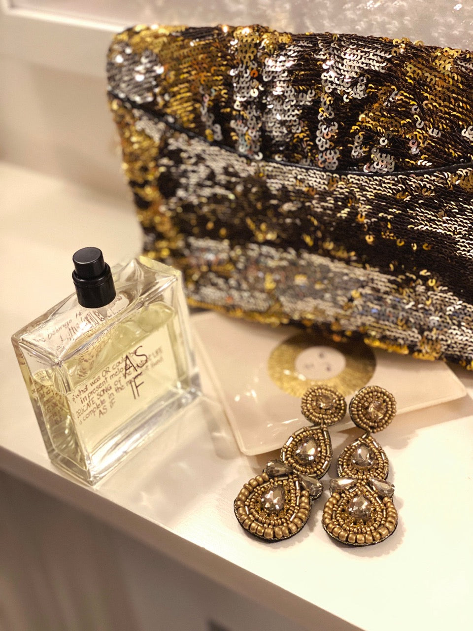 Handmade hypoallergenic gold earrings with teardrop design and unique detail.