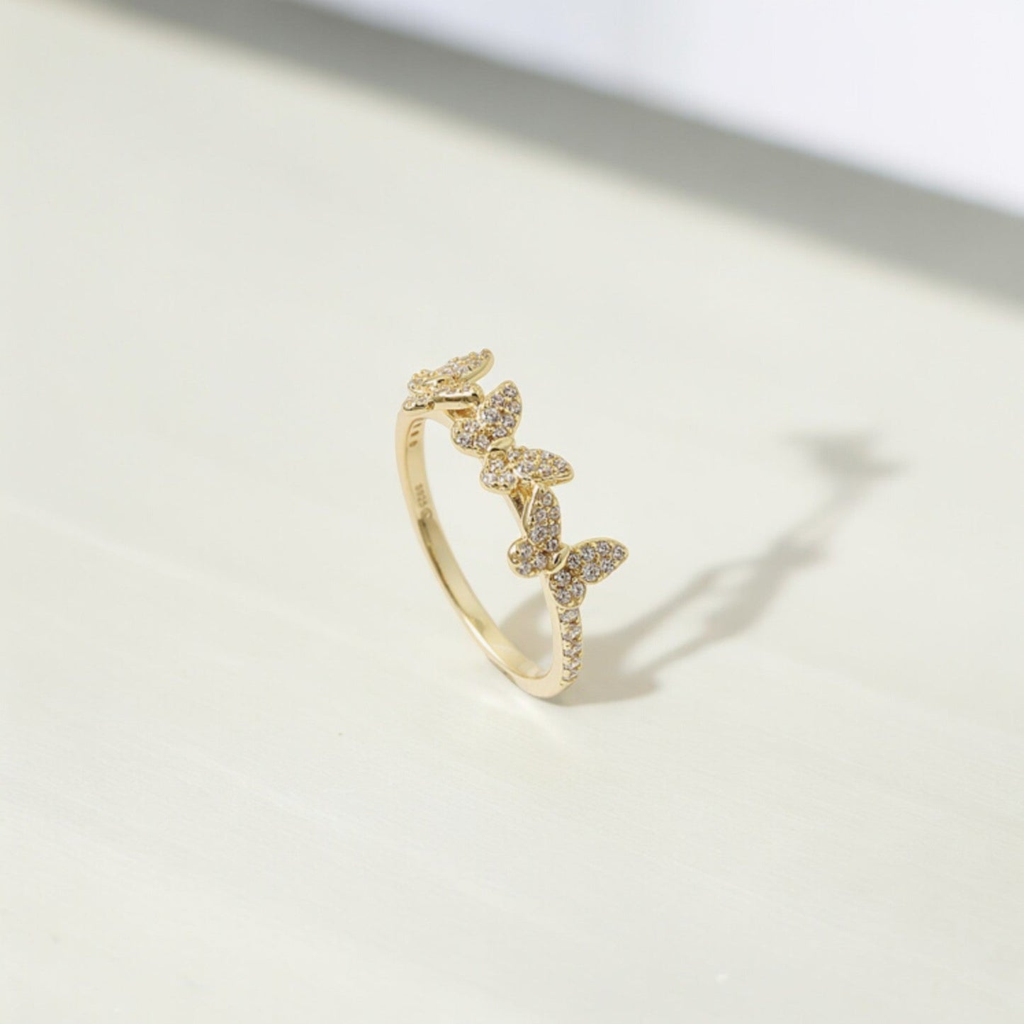 Ultra-Feminine Engagement Ring featuring a fluttering Gold Butterfly and sparkling Diamonds