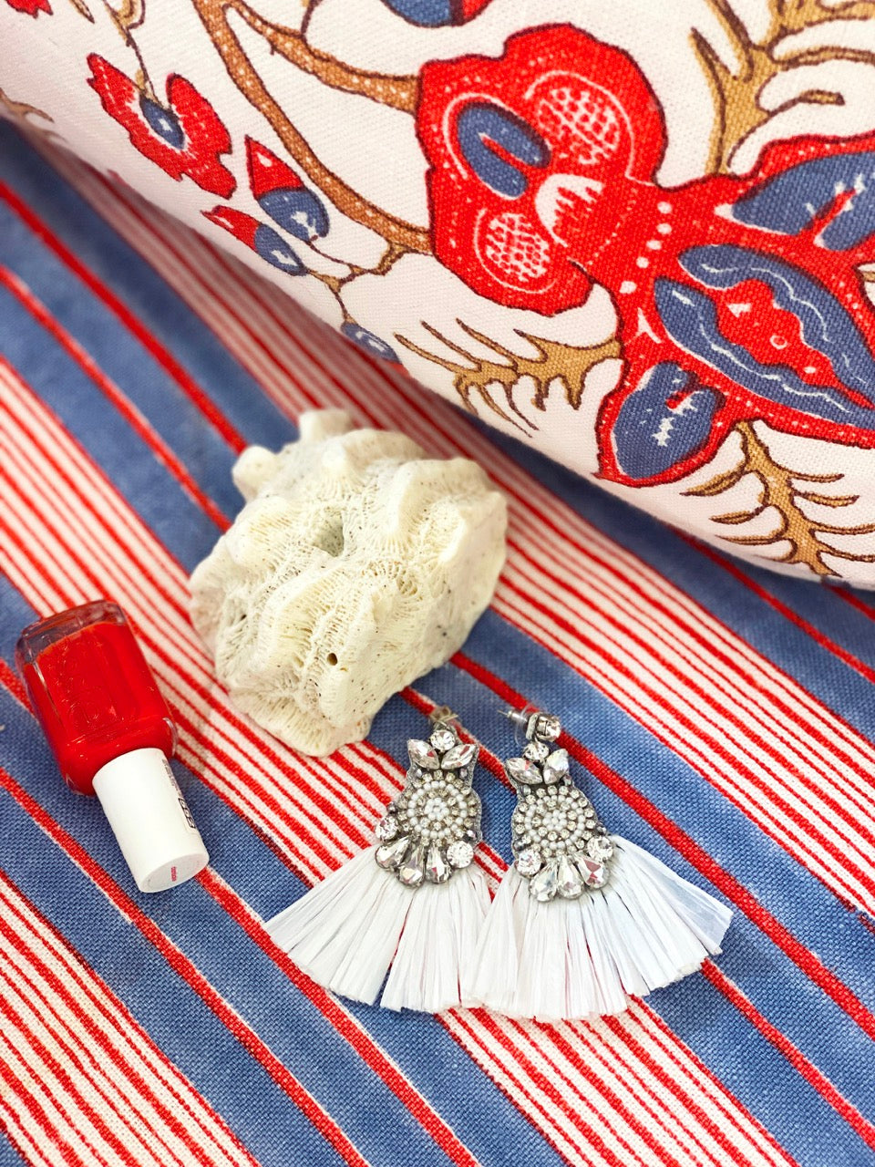 Unique handcrafted ivory earrings with fringe stitching and hypoallergenic materials.