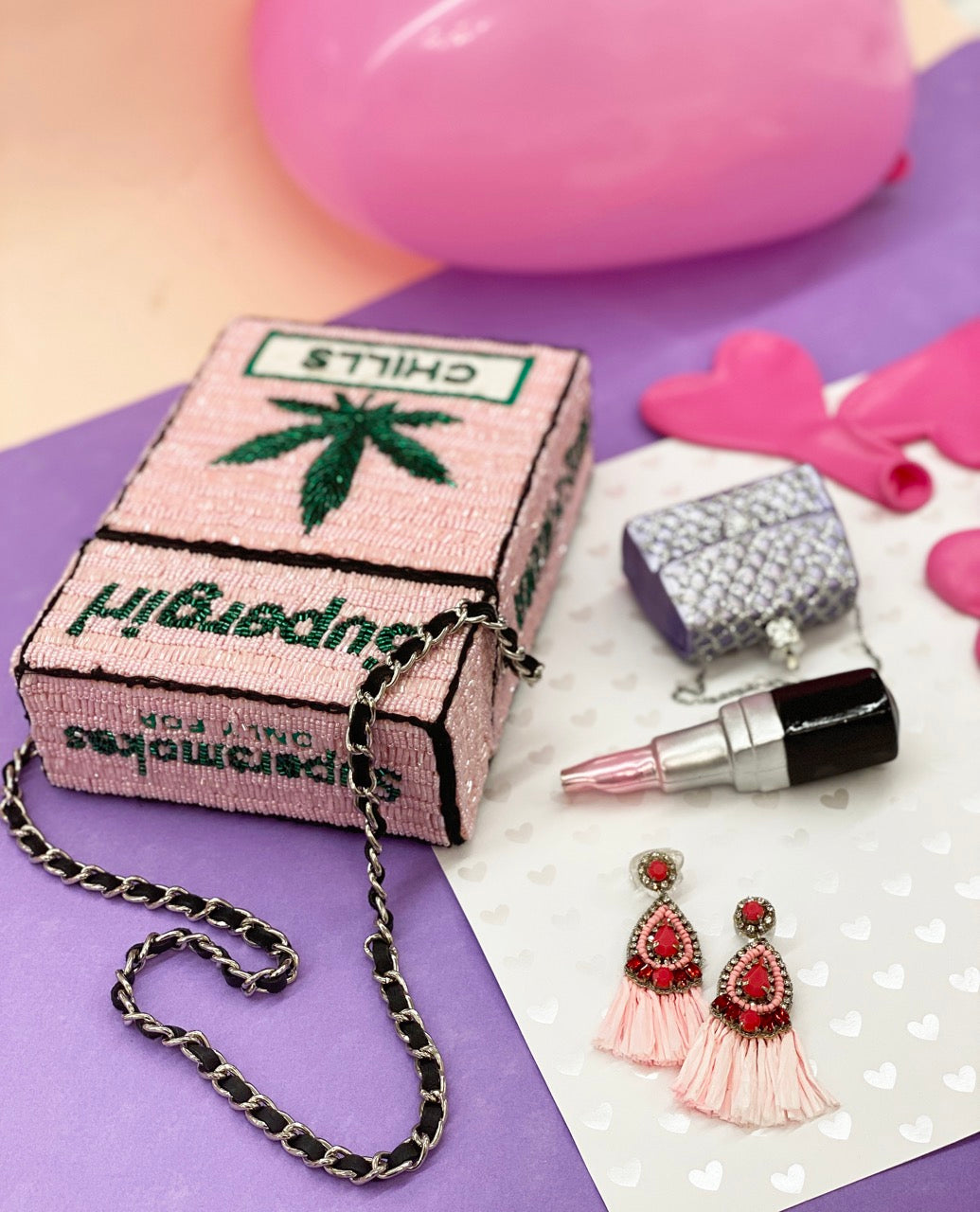 Unique handcrafted pink earrings with fringe stitching and hypoallergenic materials.