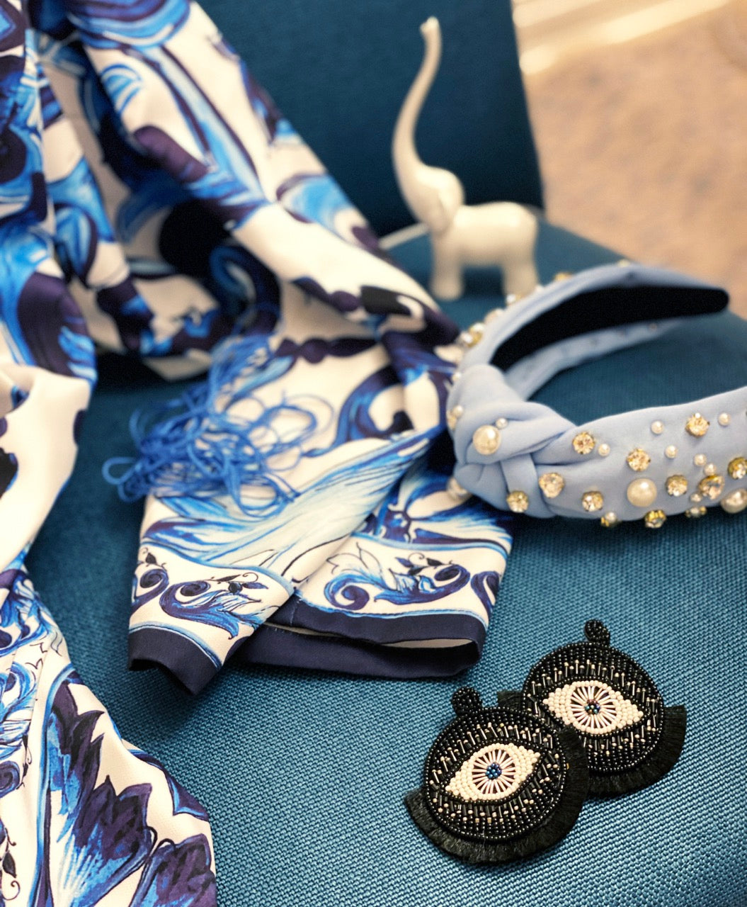 Handcrafted onyx tassel earrings with evil eye motif, perfect for adding a bold bohemian statement to any outfit.