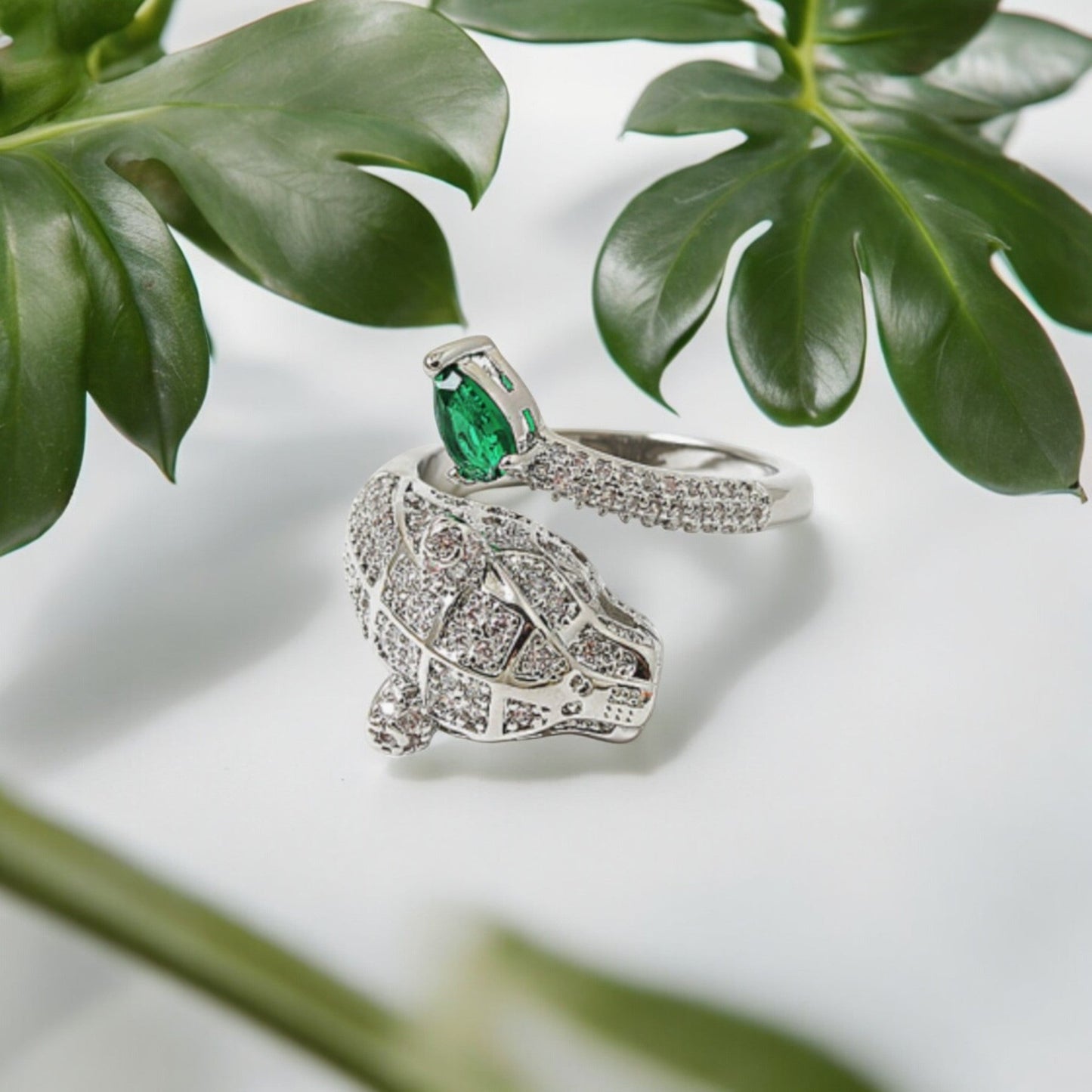 Sterling silver ring with a round cut faceted tiger's eye cabochon