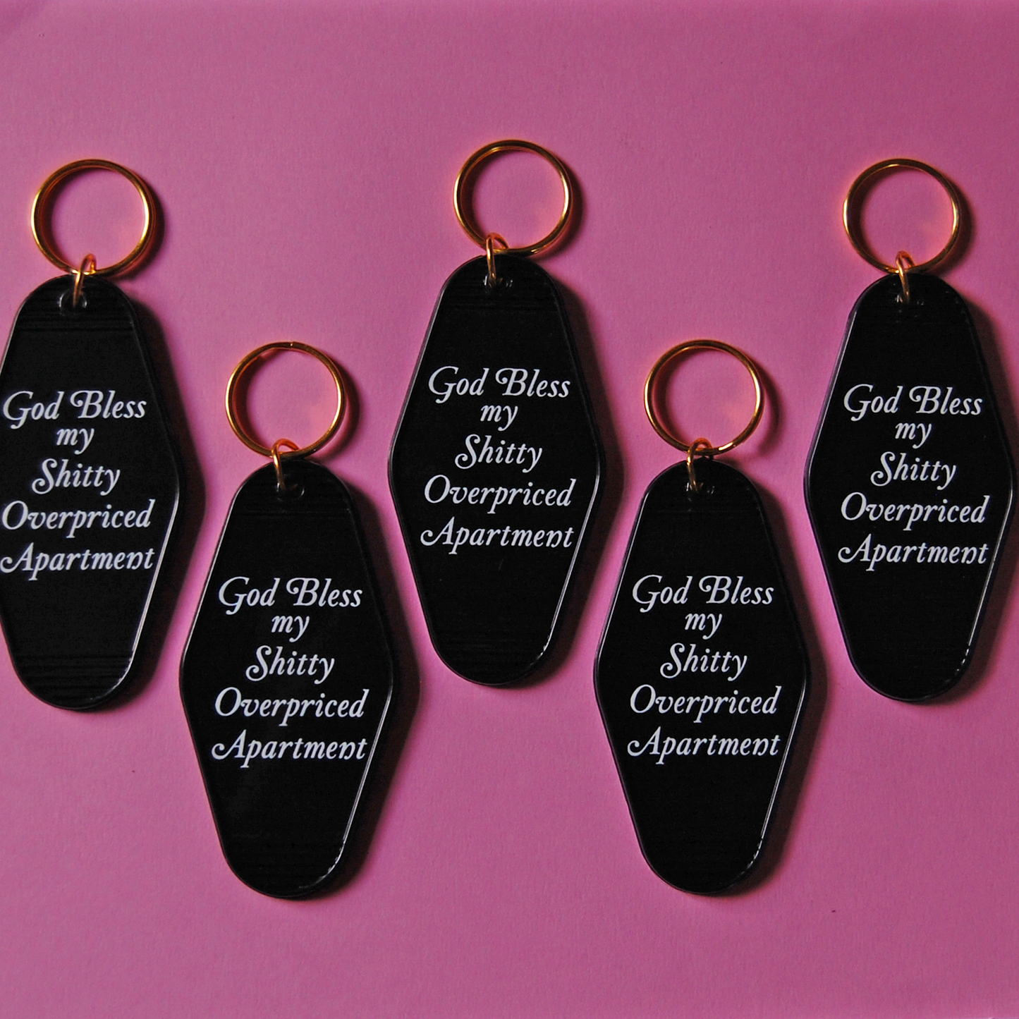 Black keychain with humorous apartment quote