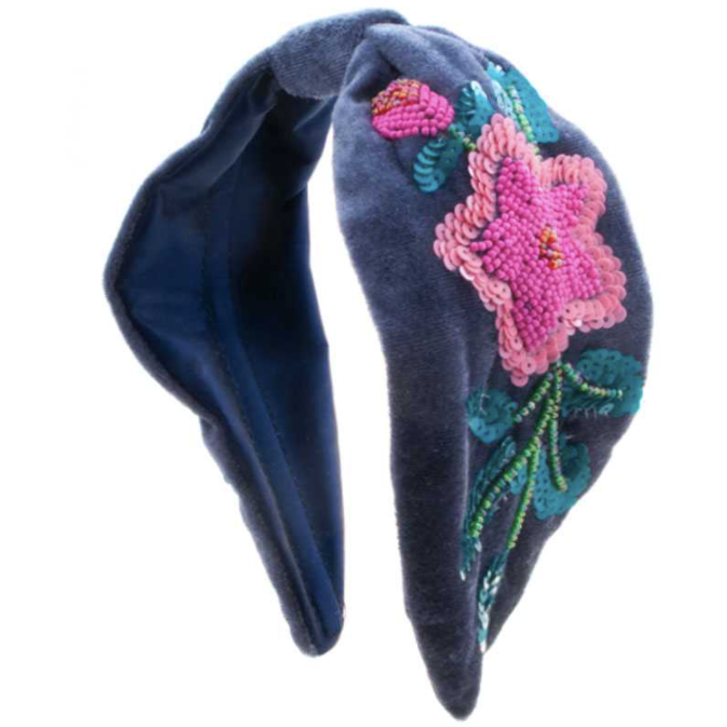 Flora and Fauna Velvet Rhinestone Statement Headband features a stunning floral and animal design adorned with dazzling rhinestones, making it perfect for any special occasion.