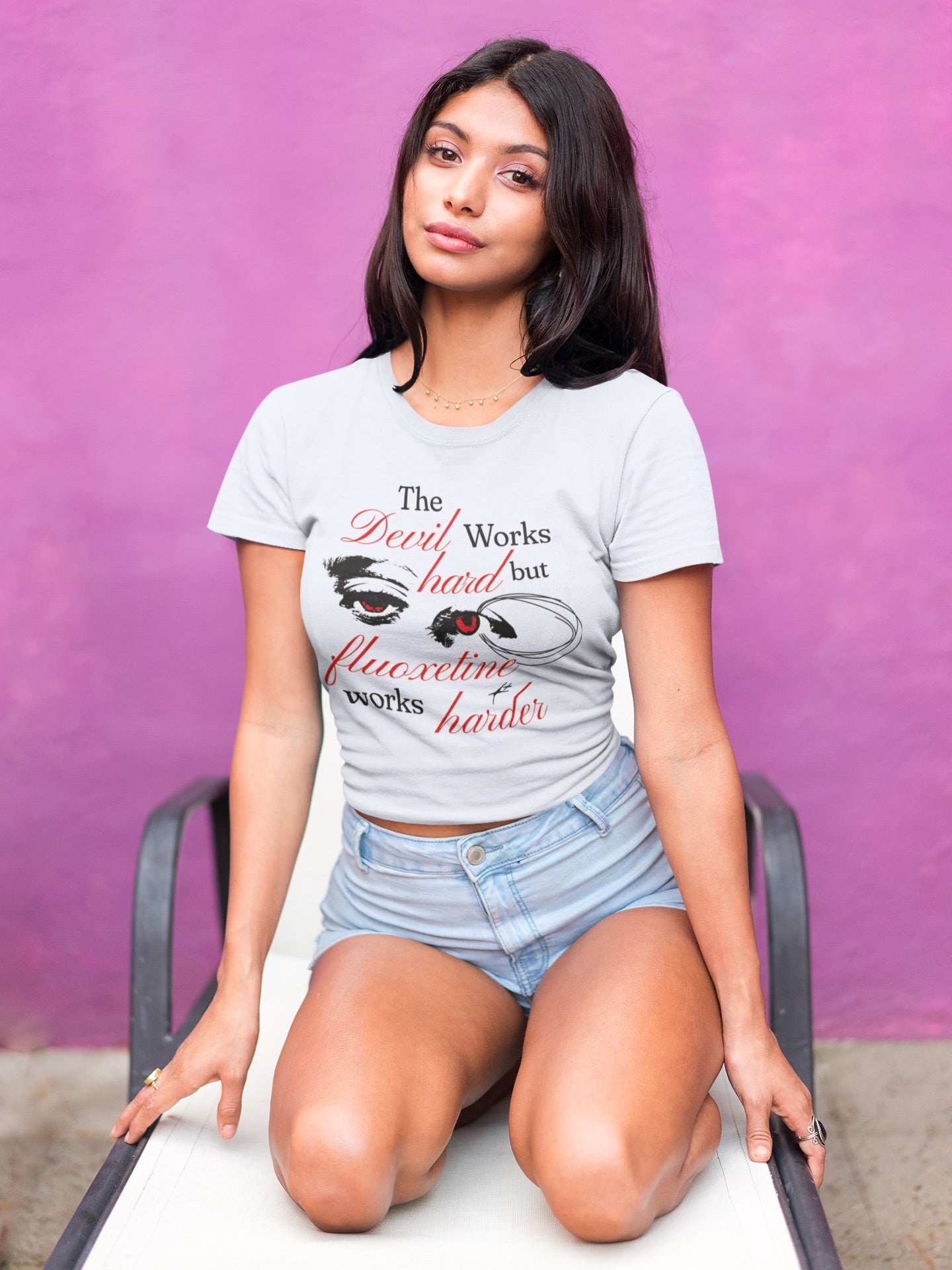 Graphic tee with a witty and creative phrase "The Devil Works Hard but Flouxetine Works Harder," perfect for everyday wear.