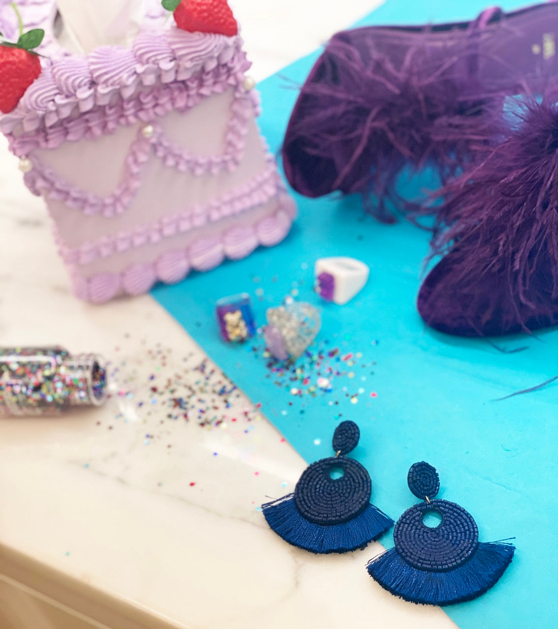Fun earrings with navy blue fringe and food-inspired hot dog and fries beading.
