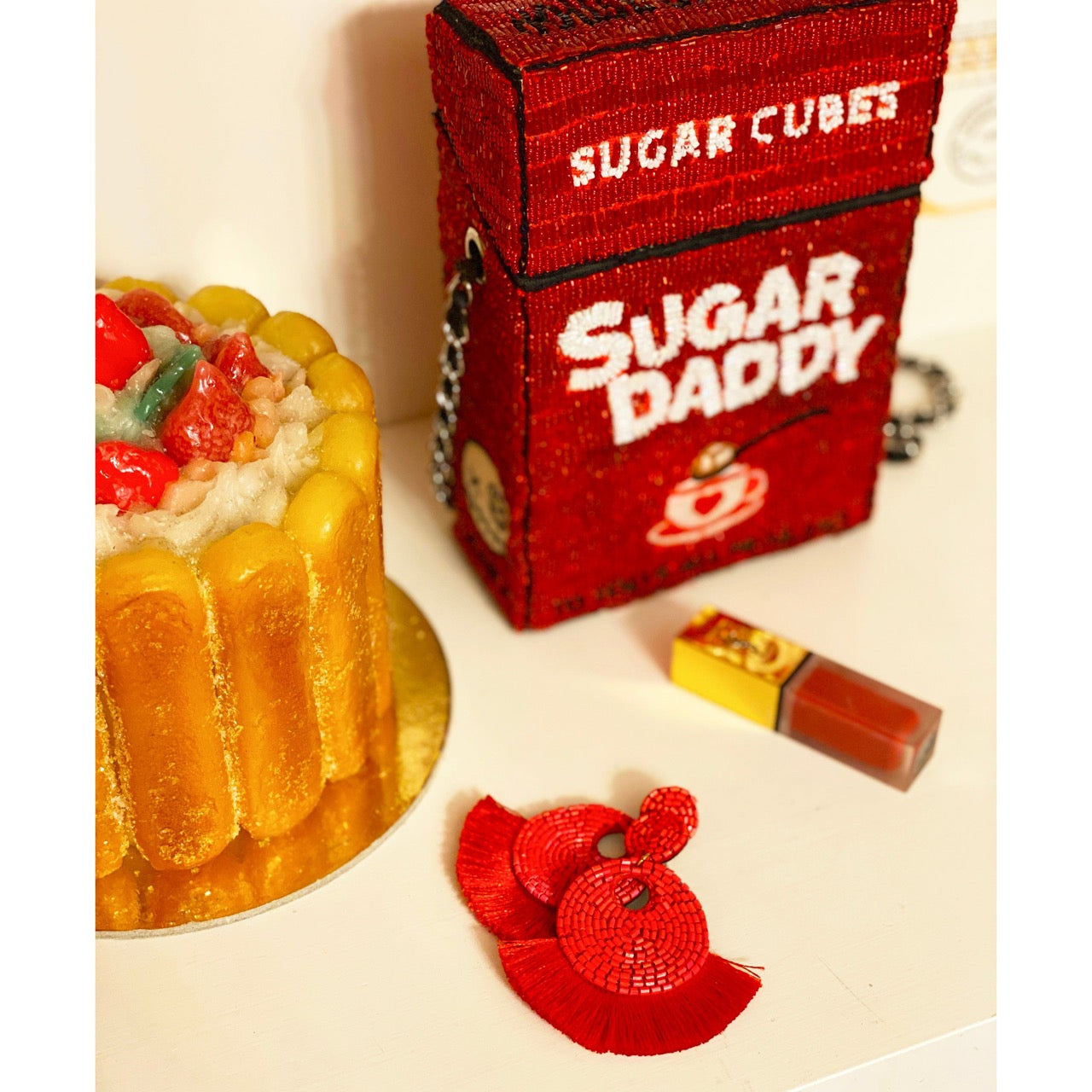 Petite red earrings with a bold fringe design, handcrafted and perfect for adding flair to any outfit.