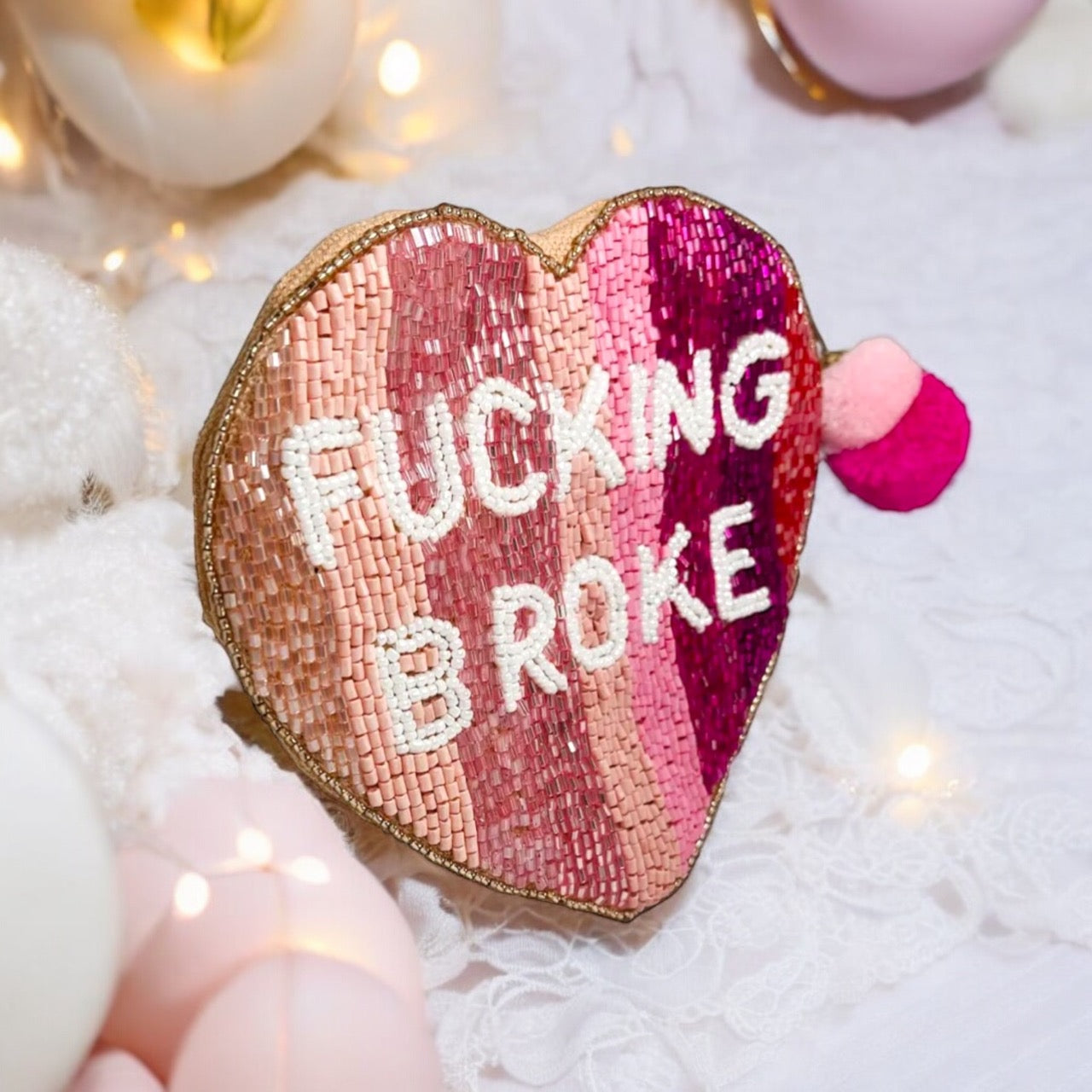 Heart-shaped clutch with beaded embellishments