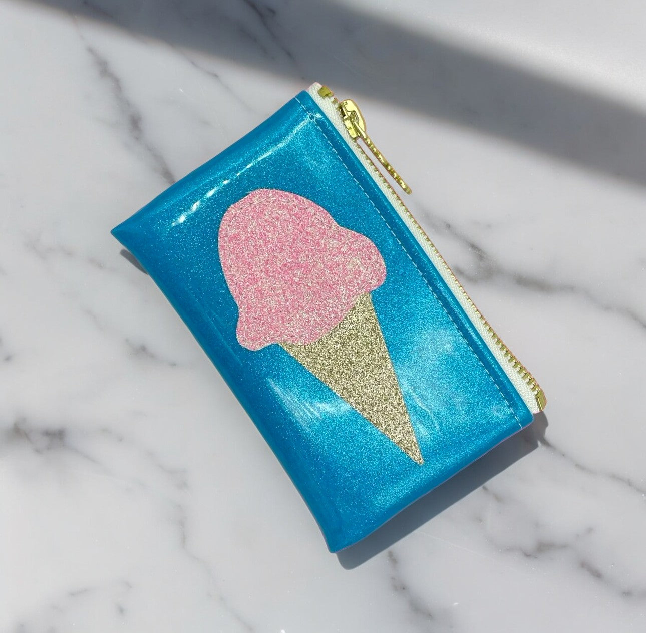 Handcrafted ice cream cone shaped clutch bag with iridescent and sparkling sequins for a touch of glam.
