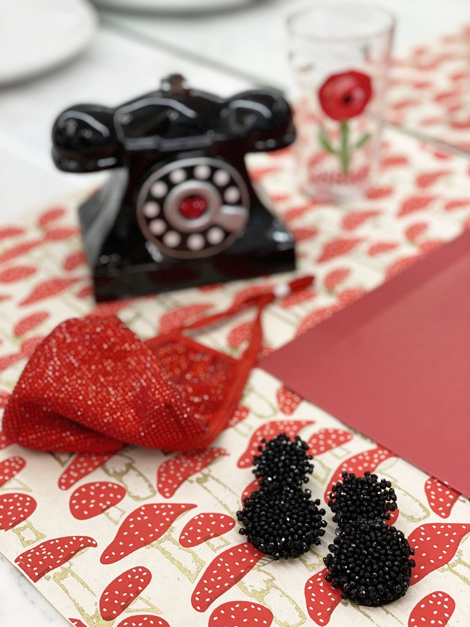 Sparkly statement earrings with bold glitterball design and colorful patch, ideal for glamorous looks.
