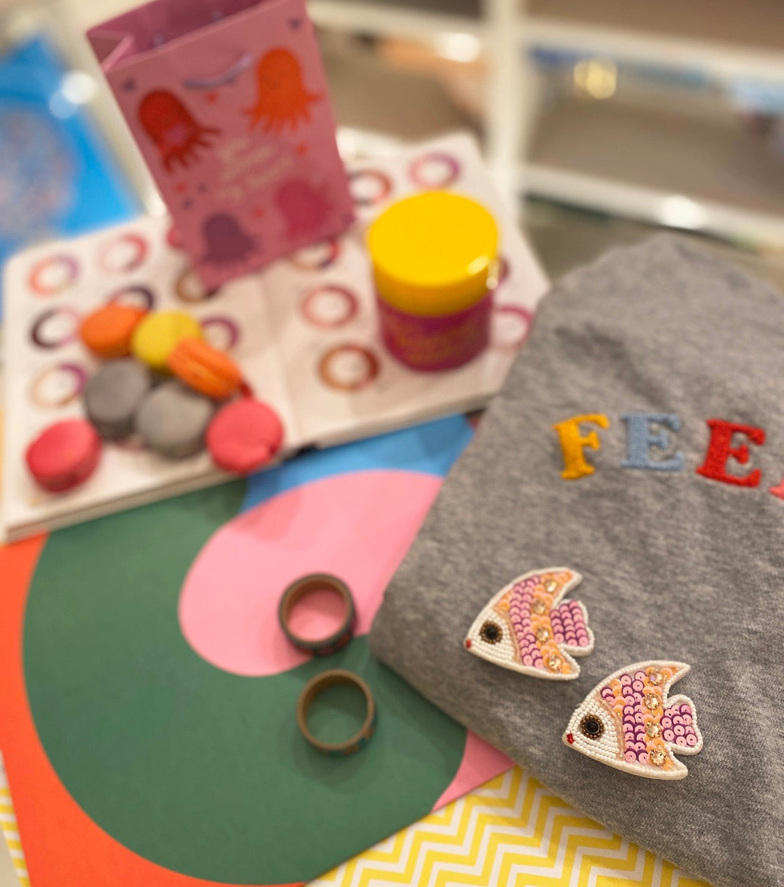 Playful sequin fish earrings with clip-on style, perfect for adding a fun pop of color to any outfit.