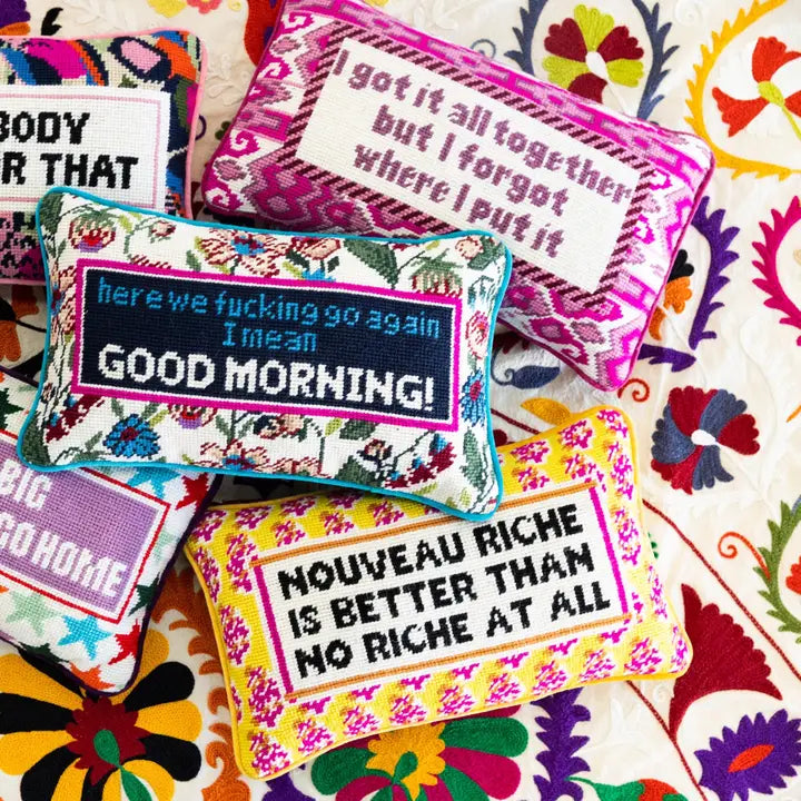 Vibrant throw pillows with a whimsical quote and durable wool front, backed with soft cotton velvet.