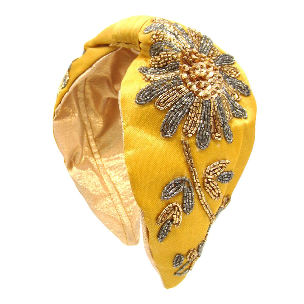 Stylish yellow headband with beaded flower design, perfect for special occasions or everyday wear.