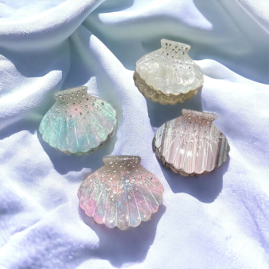 Iridescent seashell hair clips, adding a touch of coastal elegance to your hair.