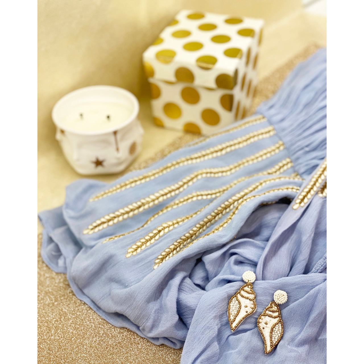 Elegant conch shell earrings in ivory with beaded details and sunglasses patch.