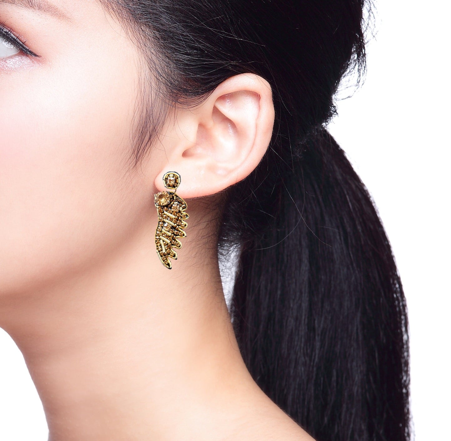 Gold Feather Wing Earrings: Statement-making gold earrings adorned with intricately detailed feathers and secure post back closures.