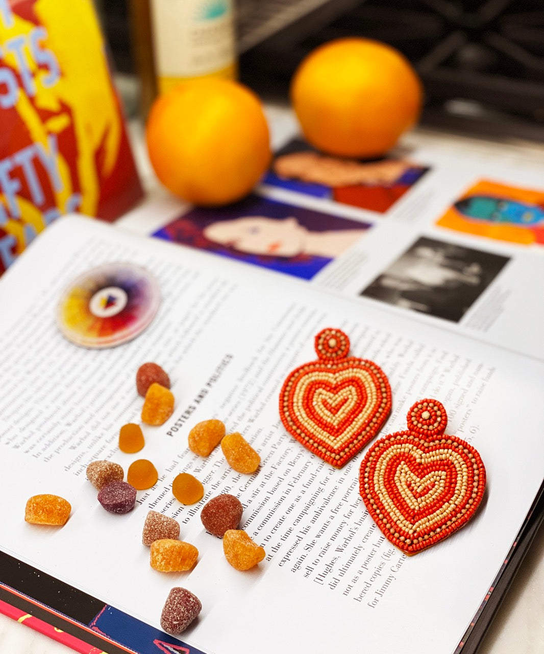 Bold tangerine earrings with coral beaded heart rings, handcrafted and hypoallergenic for sensitive skin.