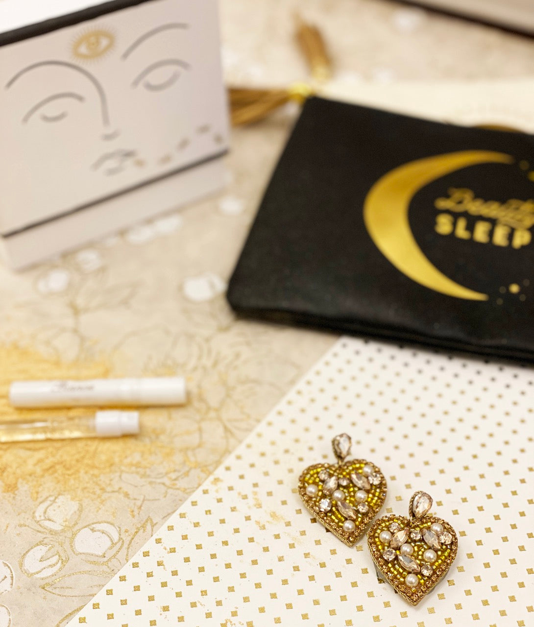 tylish Heart of Gold Earrings with metallic hearts, luminous stones, and a symbolic Lady Liberty patch, ideal for adding a touch of romance to any outfit.