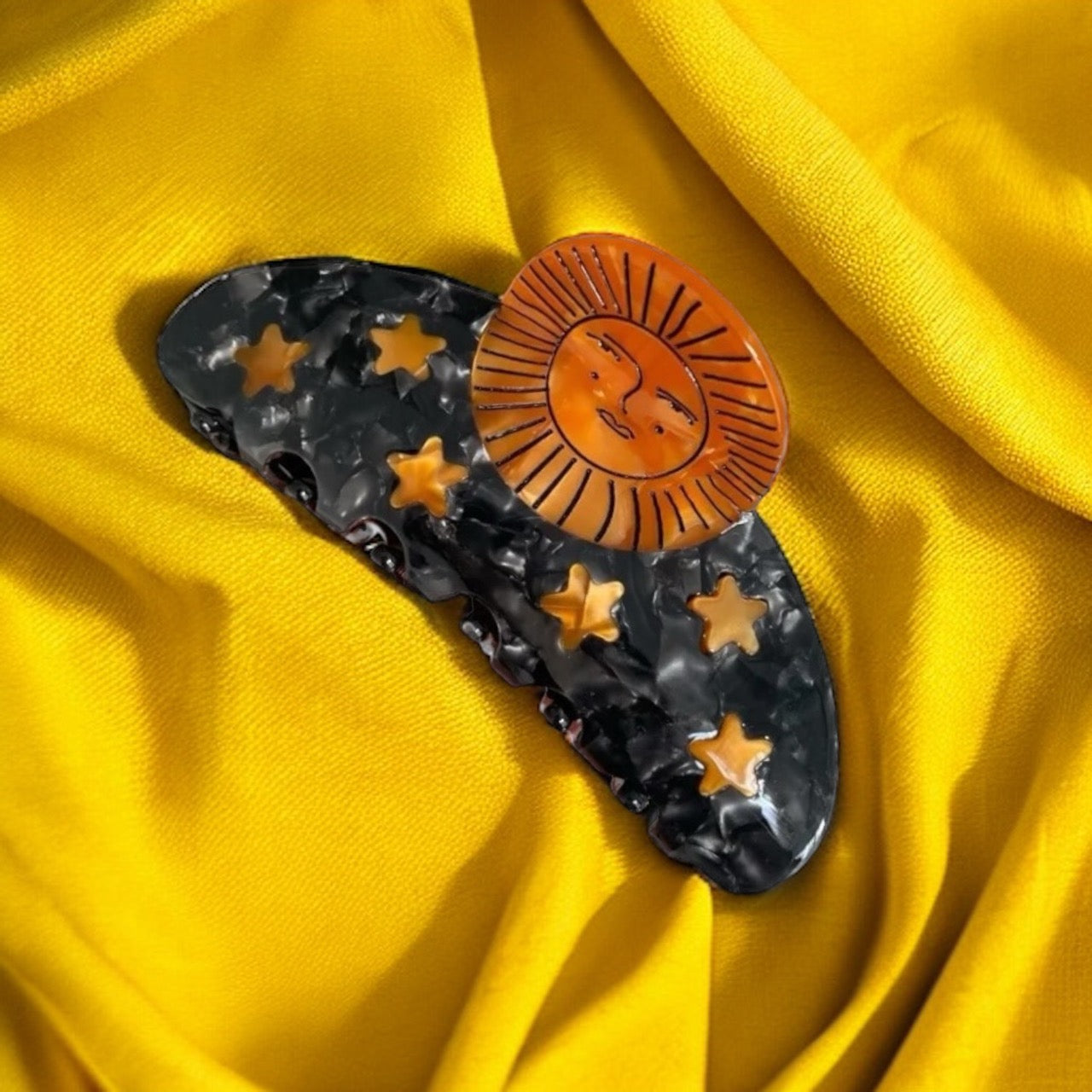 Capture the celestial beauty with these shimmering moon and star hair clips.