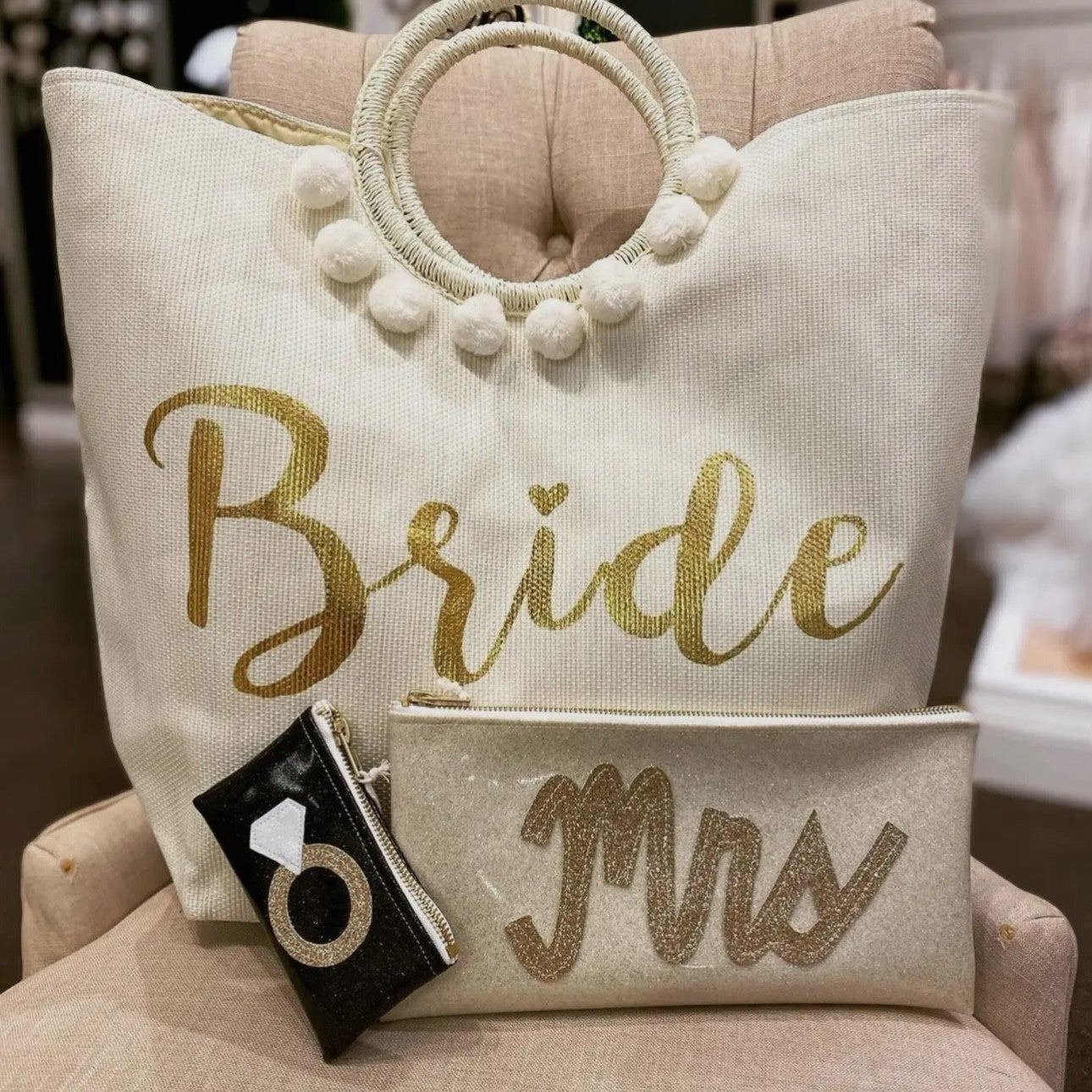 Mrs gold glitter clutch paired with a big Bride bag.