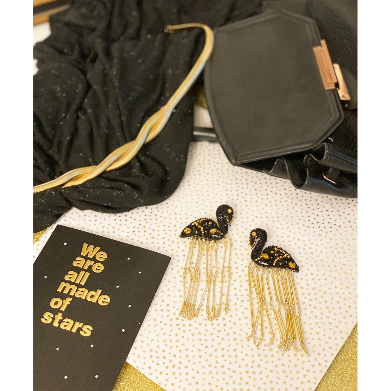 Shimmering black flamingo statement earrings, perfect for night-out glamour and playful style.