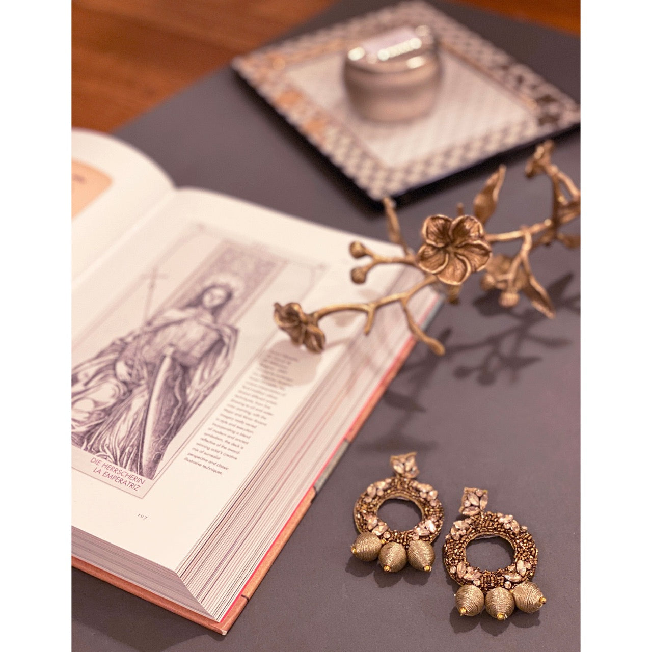 Glamorous statement earrings with pearls and text accents, perfect for maximalist fashion lovers