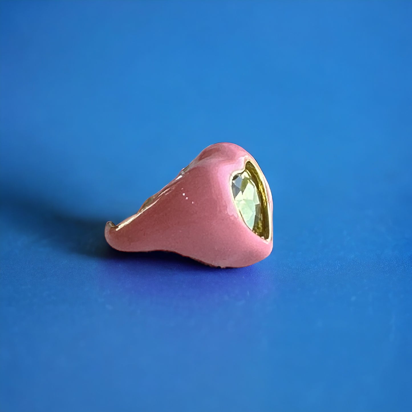 Pink heart-shaped Sailor Moon-inspired ring with gold-tone details, perfect for anime fans.