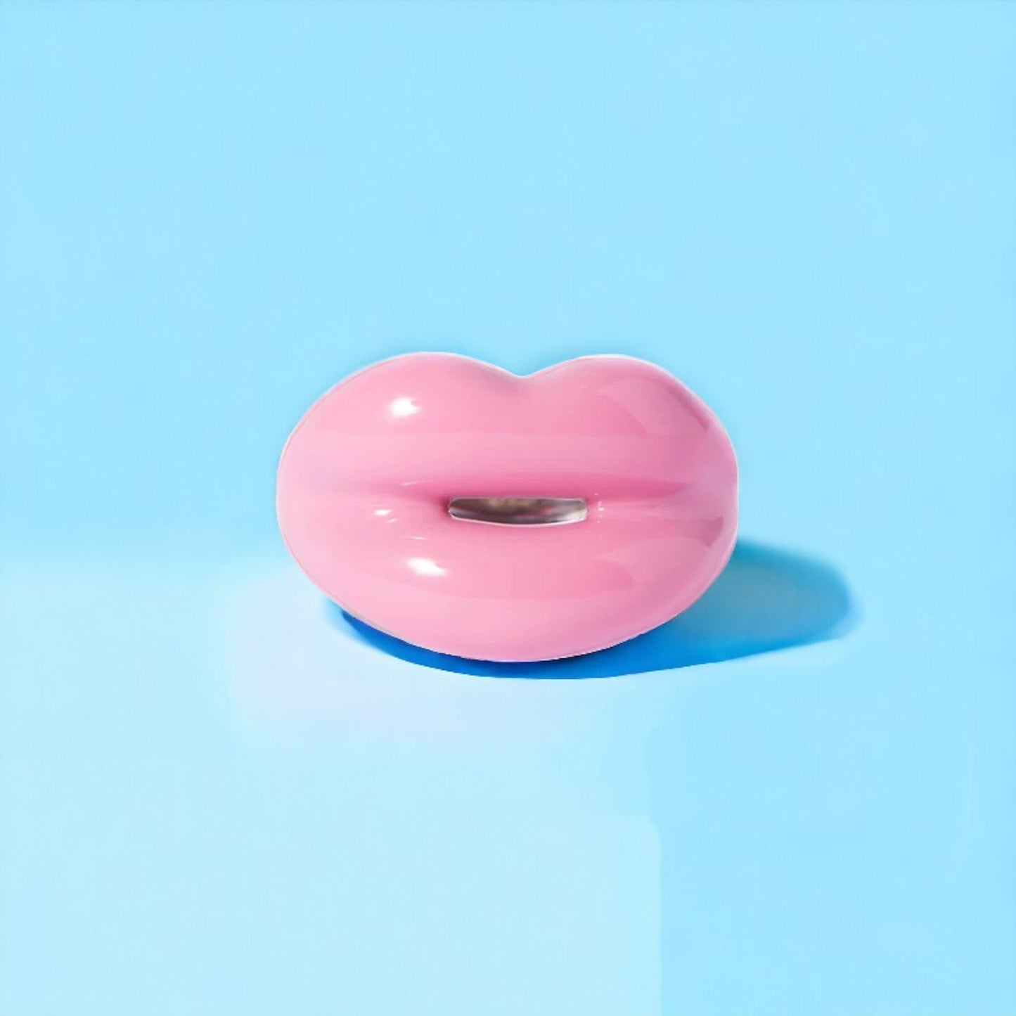 Elegant pewter and pink enamel ring adorned with a radiant solitaire stone, perfect for adding a touch of sparkle to any outfit. Keywords: pewter ring, pink enamel ring, solitaire stone ring