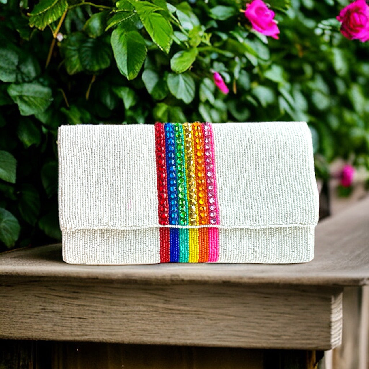 Shimmering and exquisite beaded rainbow bag, featuring a kaleidoscope of vibrant hues woven into an elegant and sophisticated silhouette.