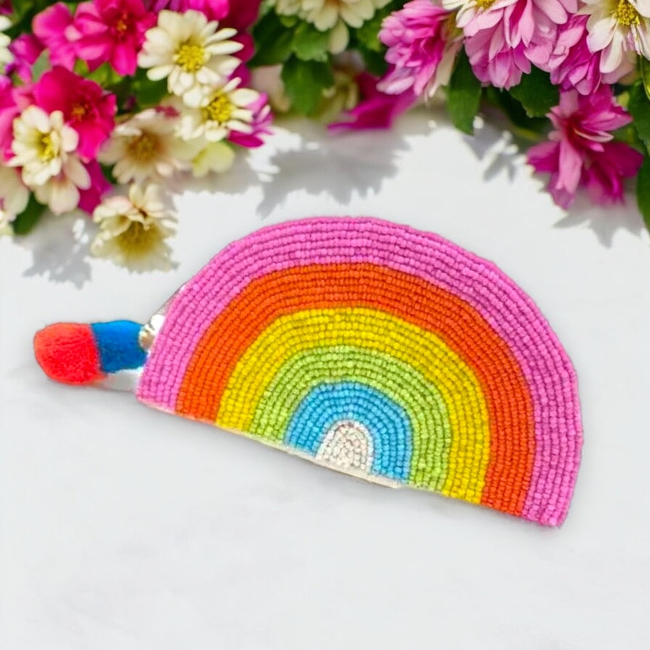 Vibrant accessory bag featuring rainbow colors.