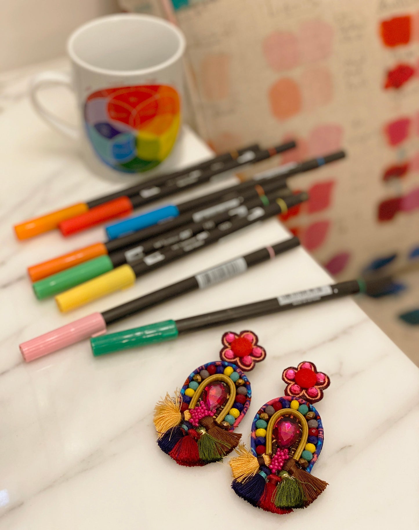 Bold and colorful Mardi Gras Earrings with unique patch designs and tassel fringes, perfect for parties and festivals.