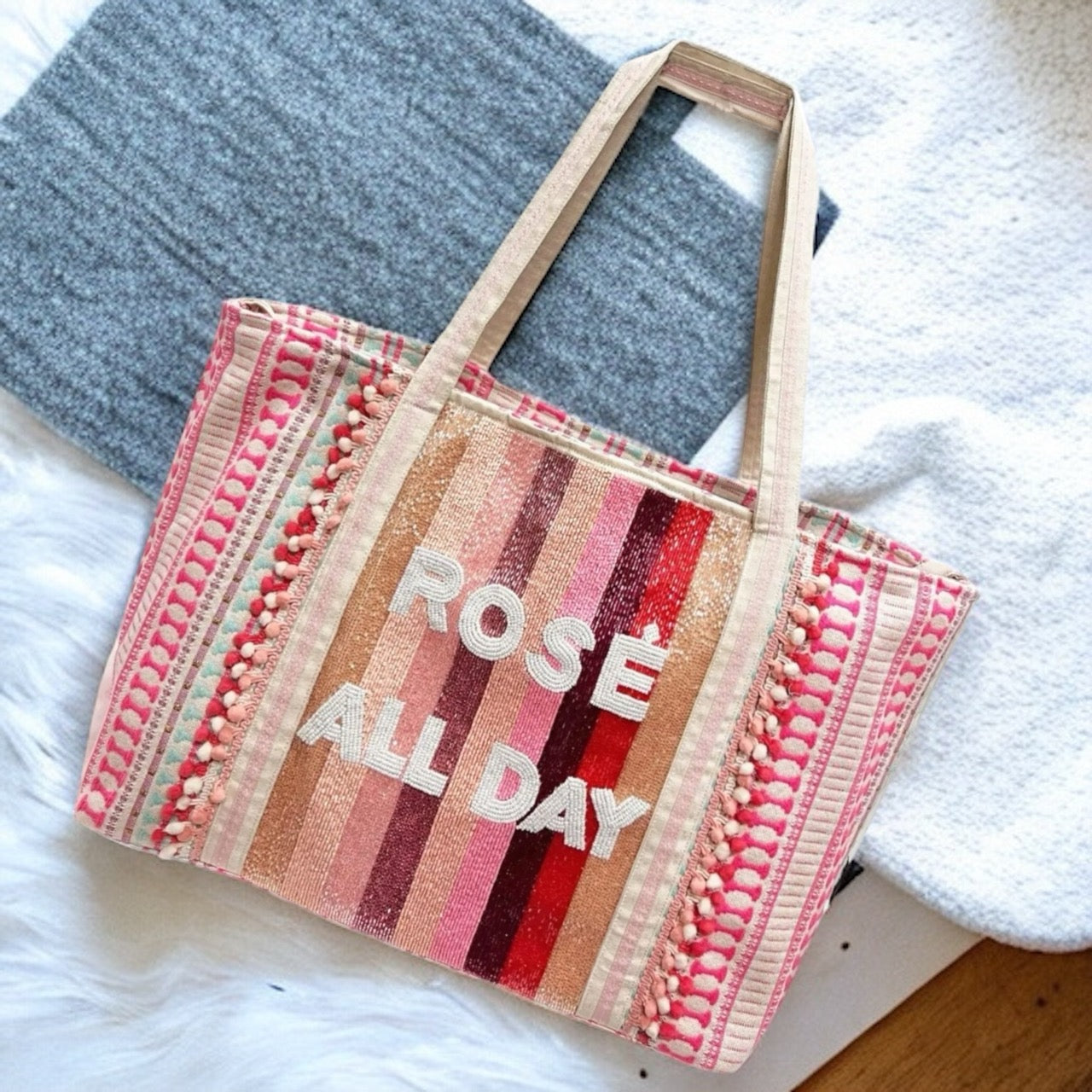 Make a statement with our "Rose All Day" tote bag! Shimmering gold sequins adorn the black fabric, creating a chic and glamorous accessory. This spacious tote can hold all your essentials while turning heads everywhere you go.