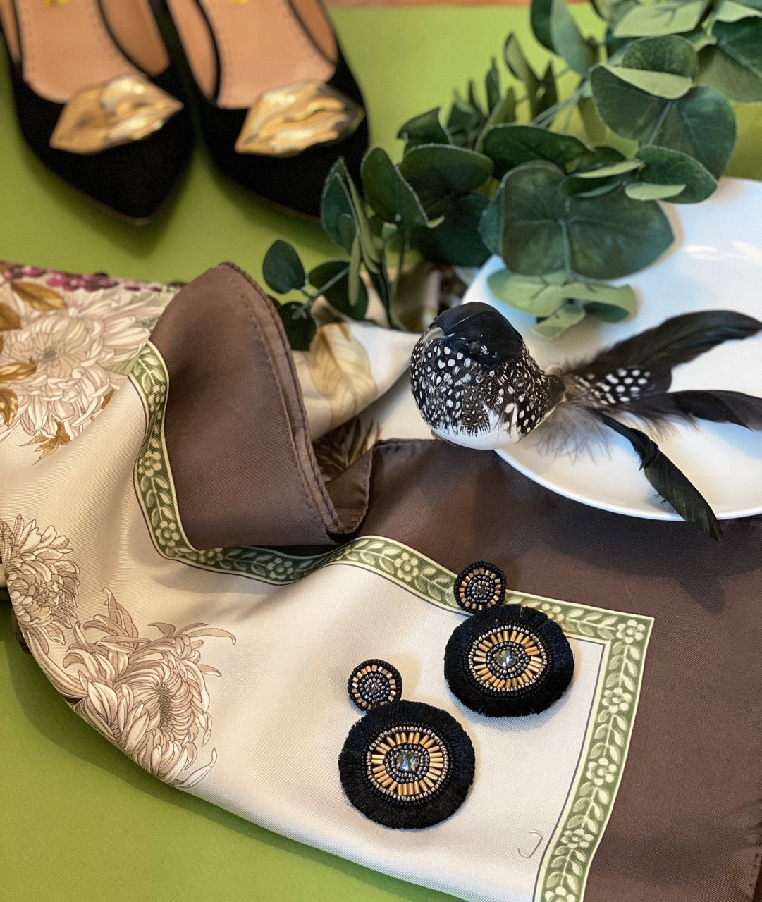 Beaded black earrings with handmade fringe and bold embroidered patch on the reverse side