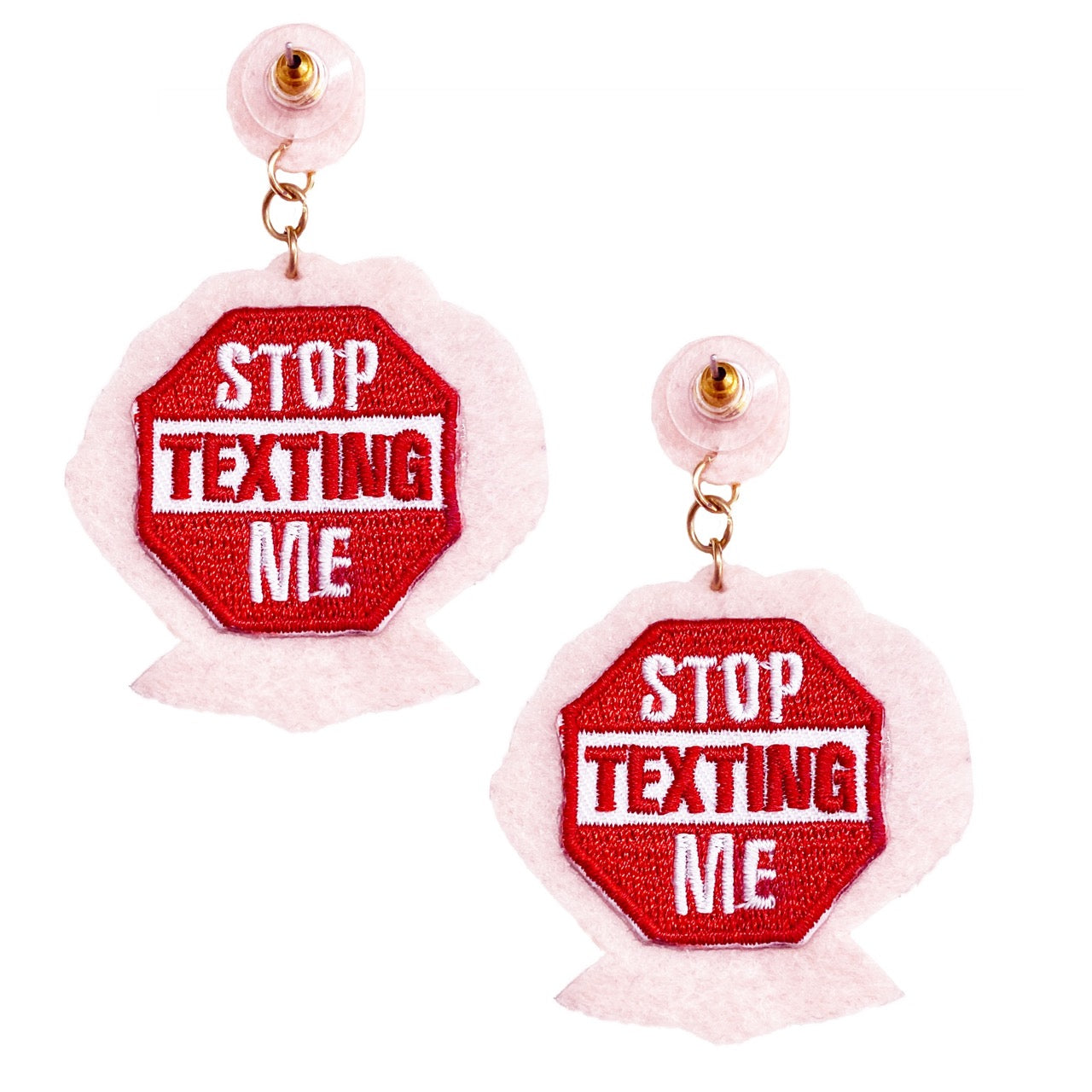 Playful blush seashell earrings with handcrafted details and a bold statement sign, perfect for summer.