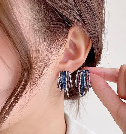Sparkly and vibrant, these rainbow spectrum acrylic earrings are the perfect accessory for any outfit.