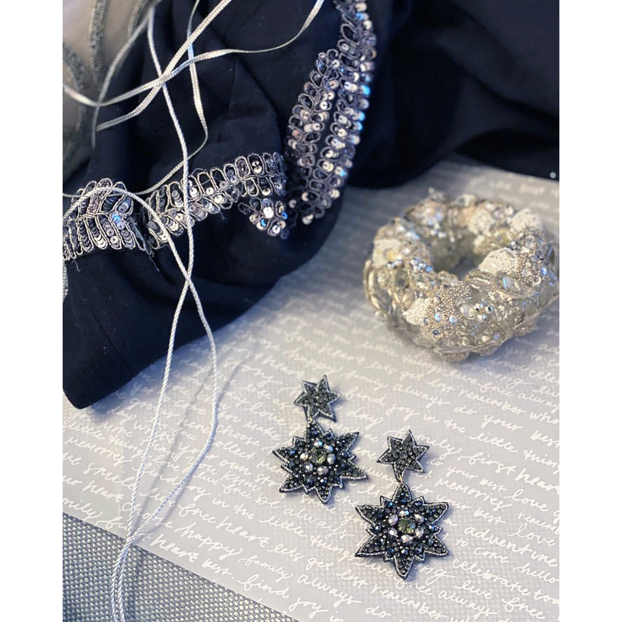 Starstruck Onyx Earrings featuring rhinestones and a "Nope" patch, perfect for bold fashion statements.