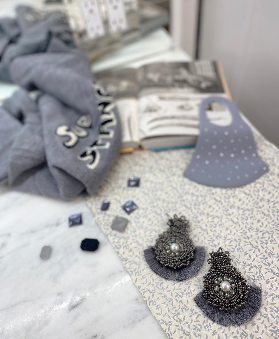 Unique gray earrings with statement patches, lightweight and hypoallergenic.