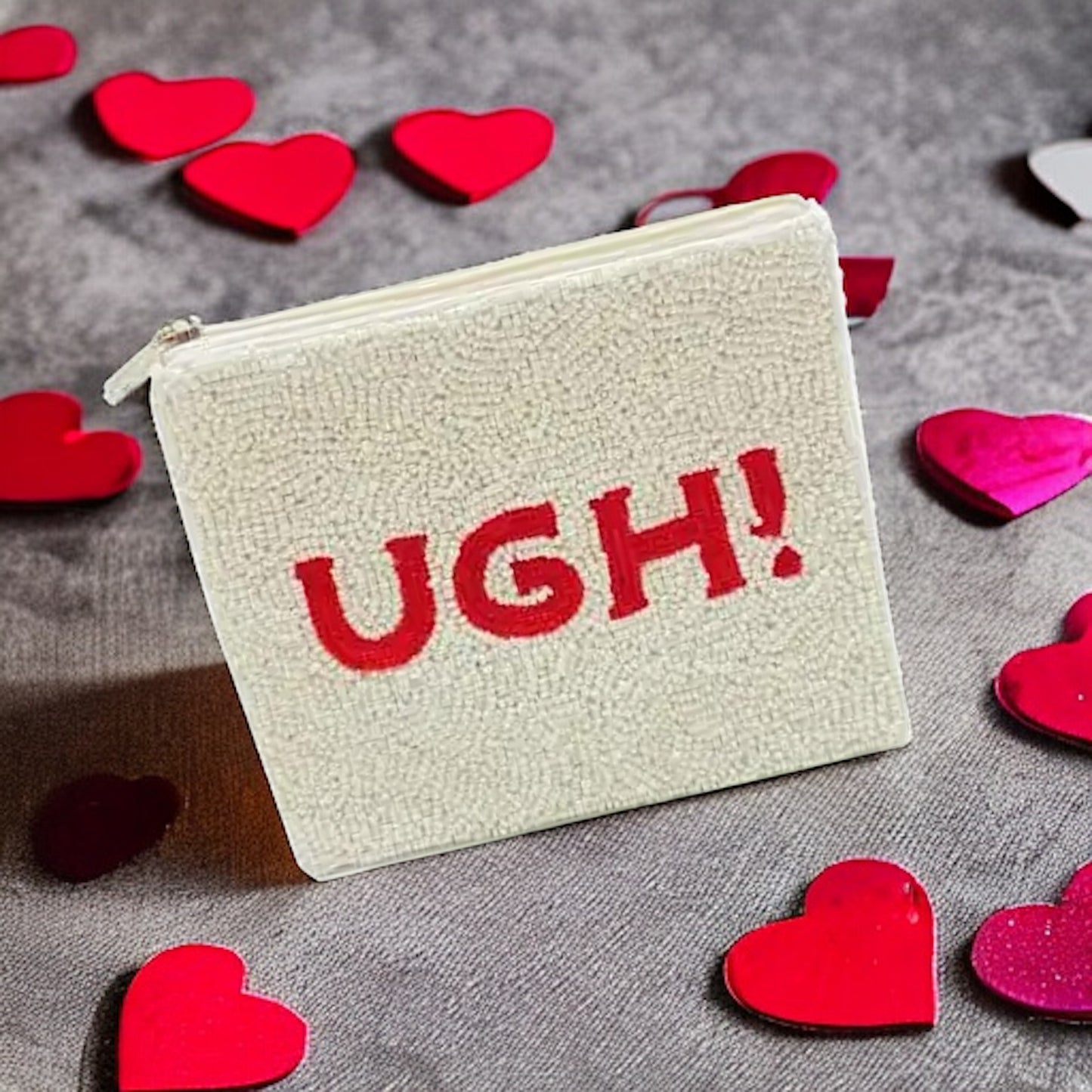Sassy beaded coin pouch with bold "UGH!" message, a fun and trendy accessory for any occasion.