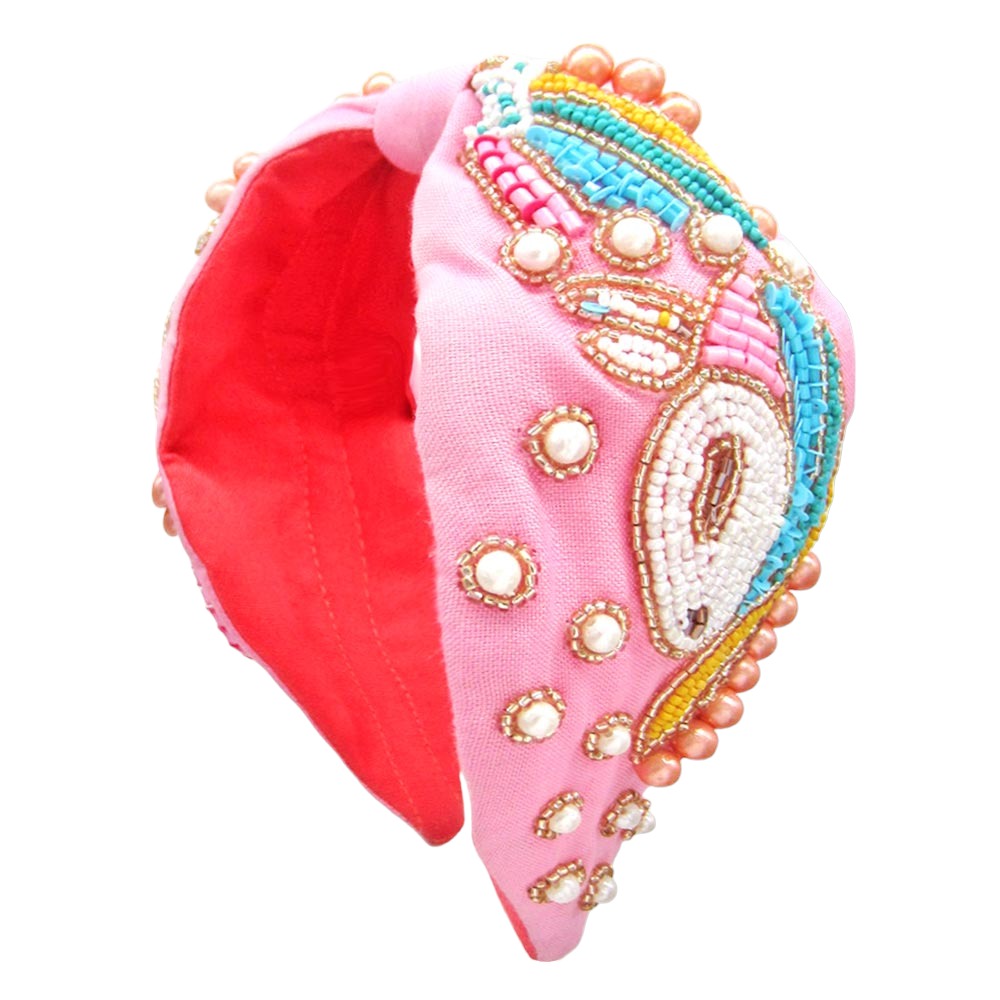 Pink headband featuring sparkly sequins and colorful jewels, a perfect hair accessory for a magical look.